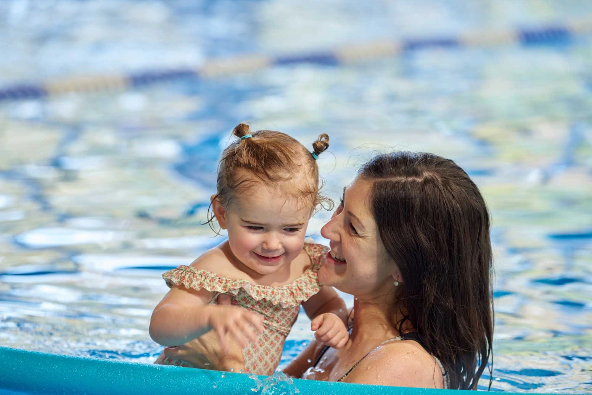 mother and daughter in pool