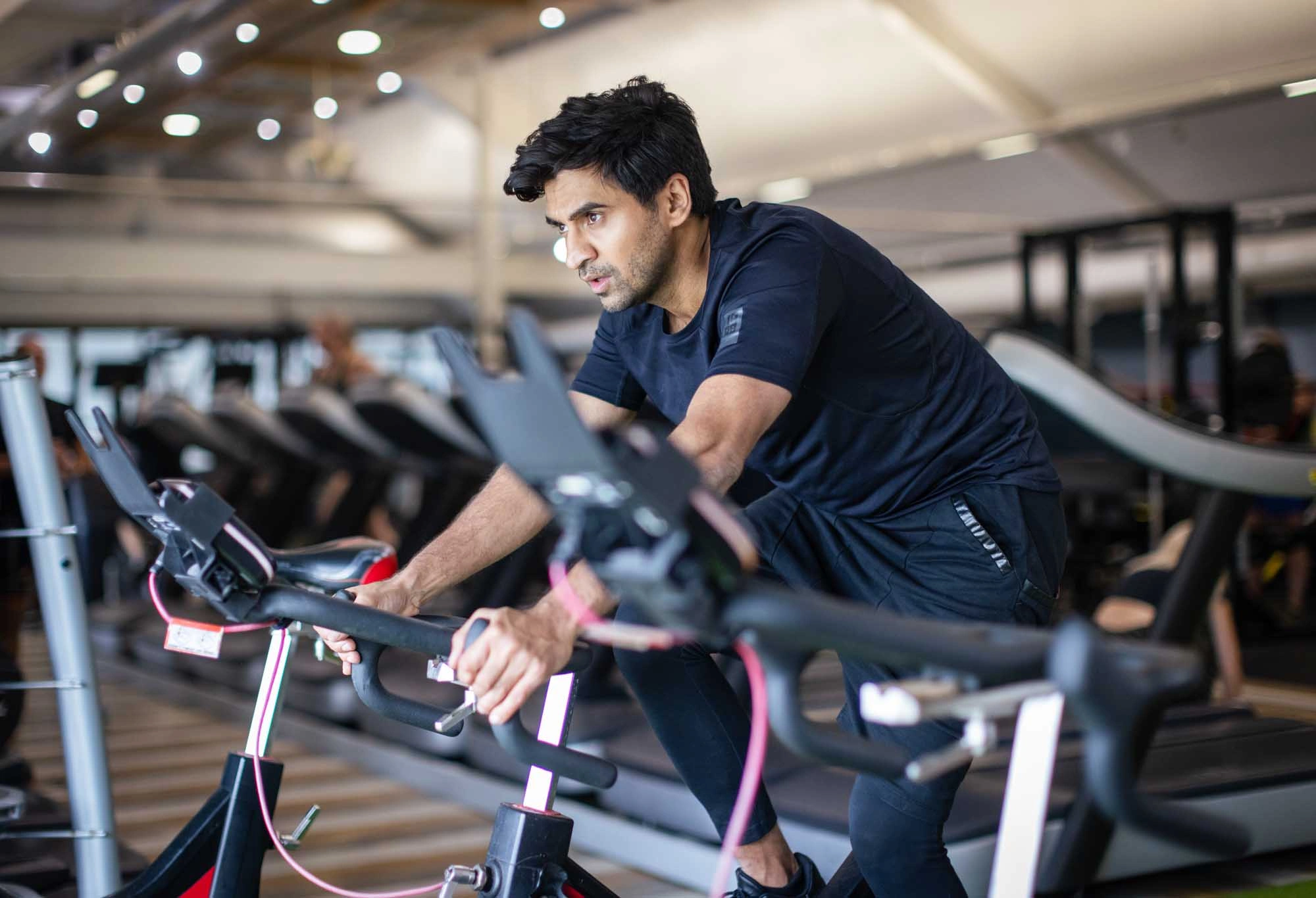 man on indoor bike