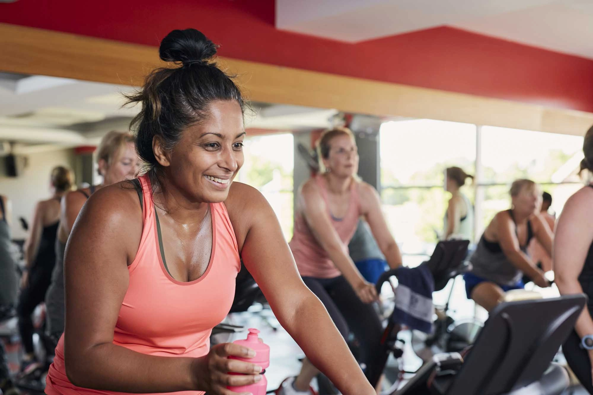 lady smiling in spin class