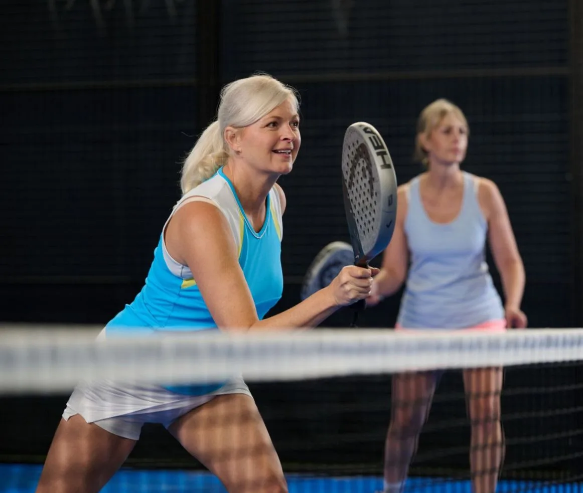 two ladies playing padel
